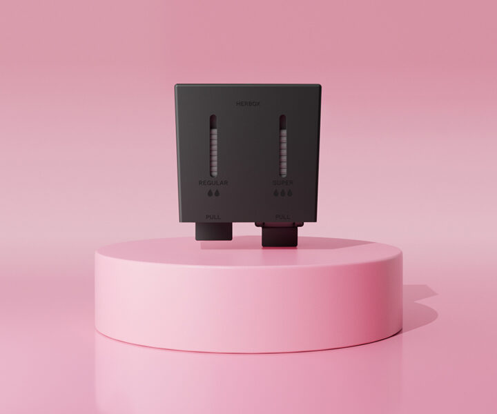 Svart Herbox digital mensskyddsautomat för tamponger regular och super på rosa podium