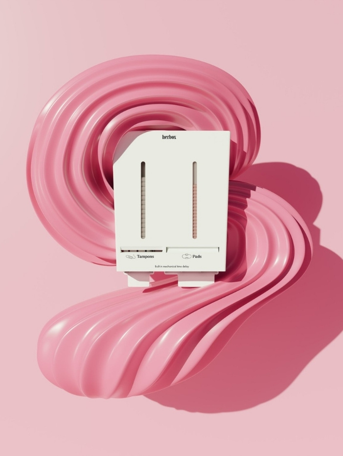 Vit väggmonterad behållare för mensskydd på rosa bakgrund med flytande former.